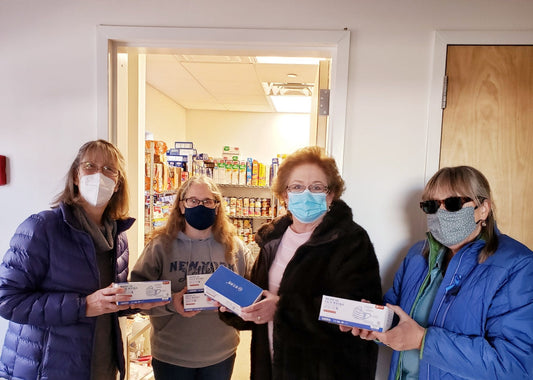 Deirdre Dubato and Suzanne Johnson present to one of the many organizations the Rocky Point Rotary Club donated masks to.