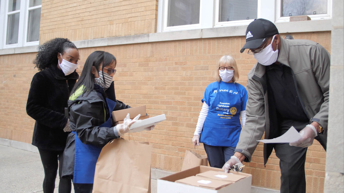 During the COVID-19 pandemic, members of the Rotary Club of Evanston Lighthouse deliver meals to residents living in homes developed by Reba Place Development Corp., a community organization that supports affordable housing in Evanston, Illinois, USA.
